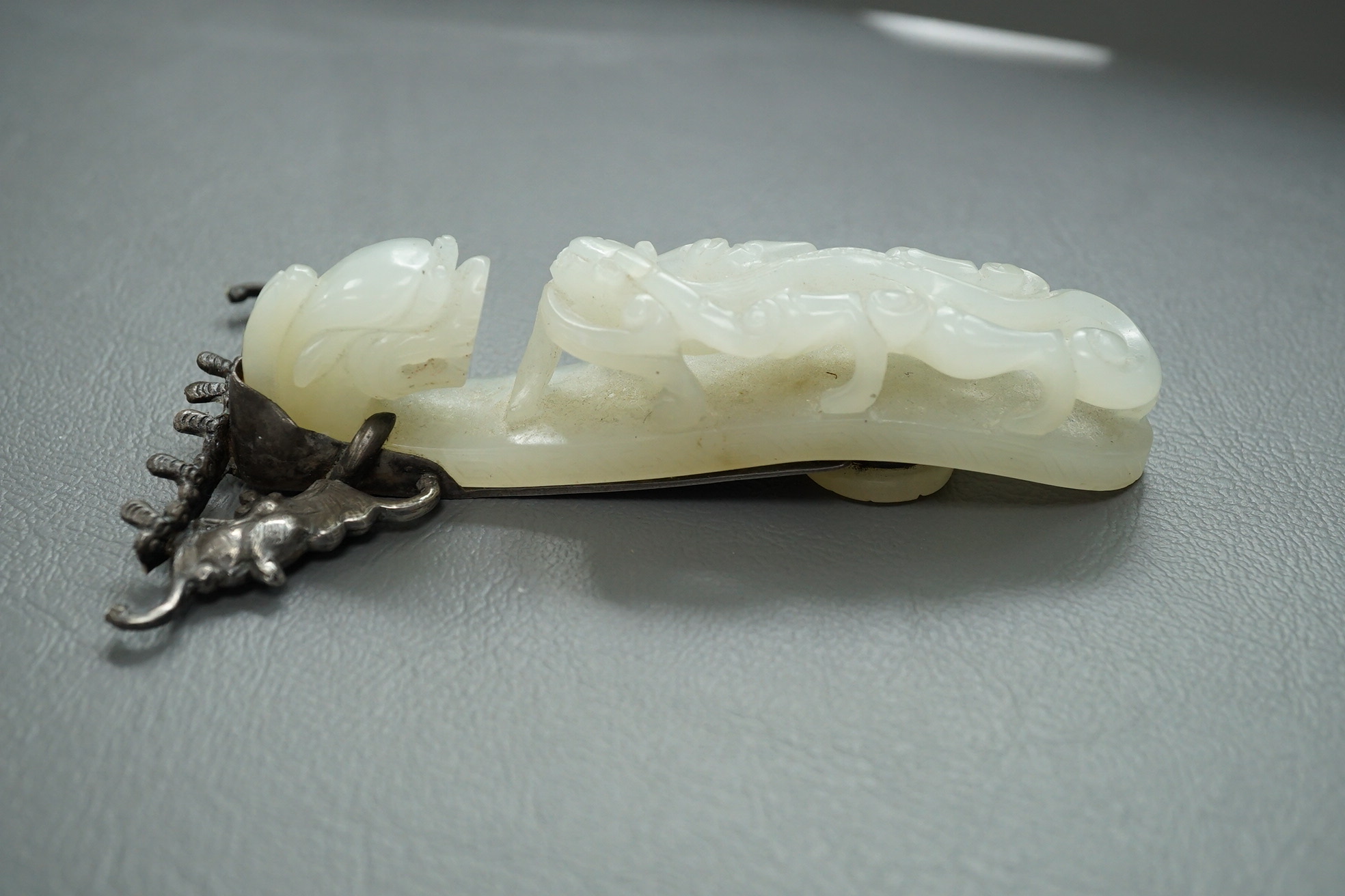 A Chinese jade and cabochon mounted hand mirror, the jade 18th/19th century
